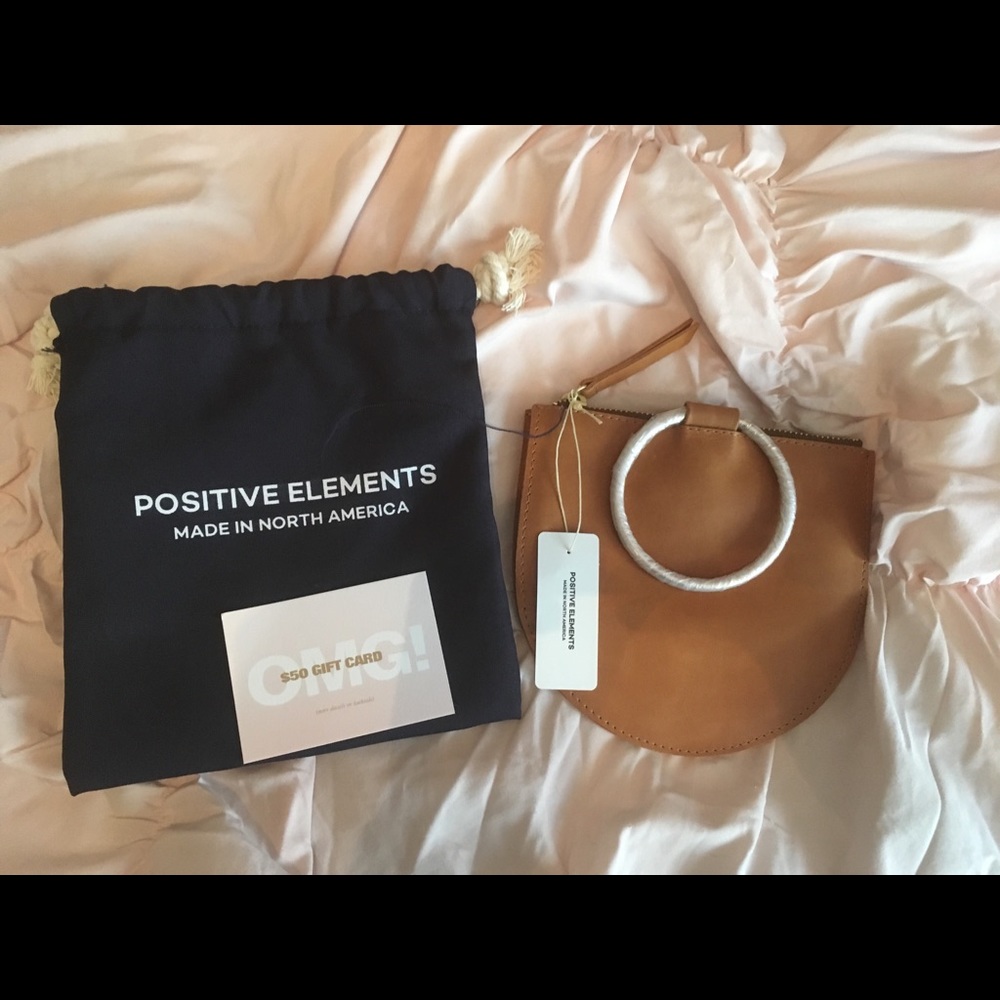 Tan joy pouch with $50 gift card